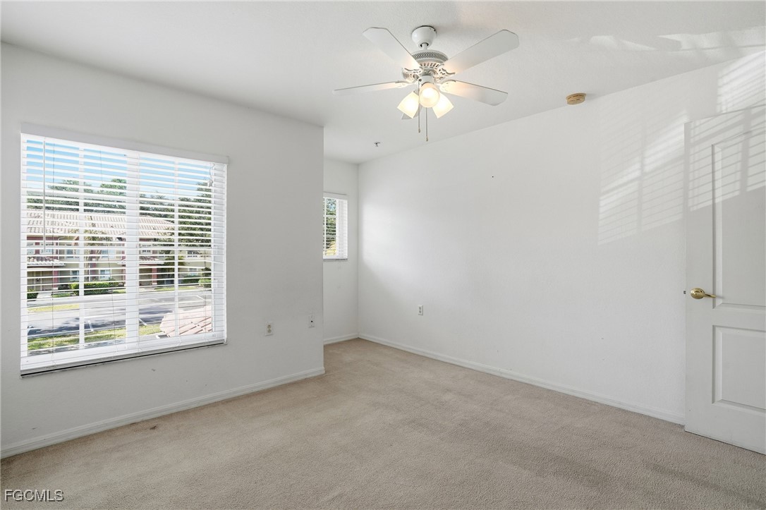 9409 Ivy Brook Run, Unit 1306 Fort Myers, FL 33913 - Photo 25 of 43 a view of an empty room with a window