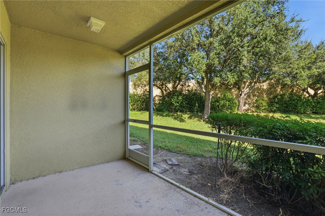 9409 Ivy Brook Run, Unit 1306 Fort Myers, FL 33913 - Photo 35 of 43 a view of a yard with wooden fence