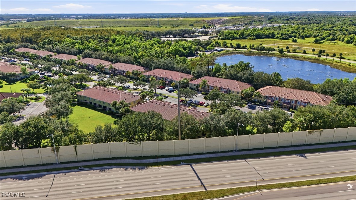 9409 Ivy Brook Run, Unit 1306 Fort Myers, FL 33913 - Photo 40 of 43 an aerial view of lake and residential houses with outdoor space