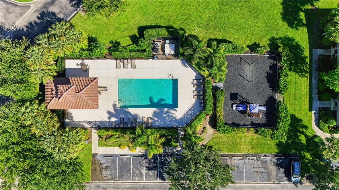 9409 Ivy Brook Run, Unit 1306 Fort Myers, FL 33913 - Photo 41 of 43 an aerial view of a house with a swimming pool a yard and outdoor seating
