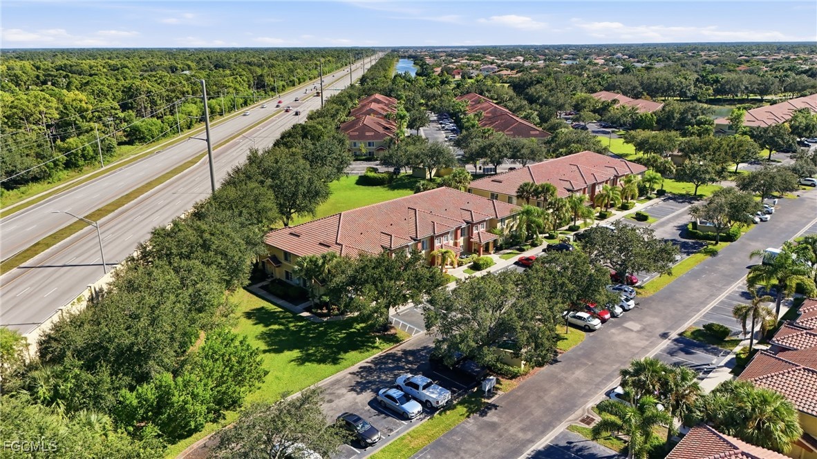 9409 Ivy Brook Run, Unit 1306 Fort Myers, FL 33913 - Photo 6 of 43 an aerial view of house with yard