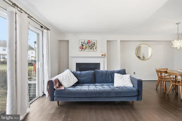 a living room with furniture rug and window