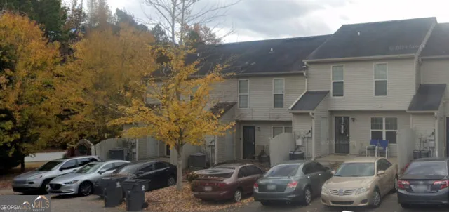 a car parked in front of a house