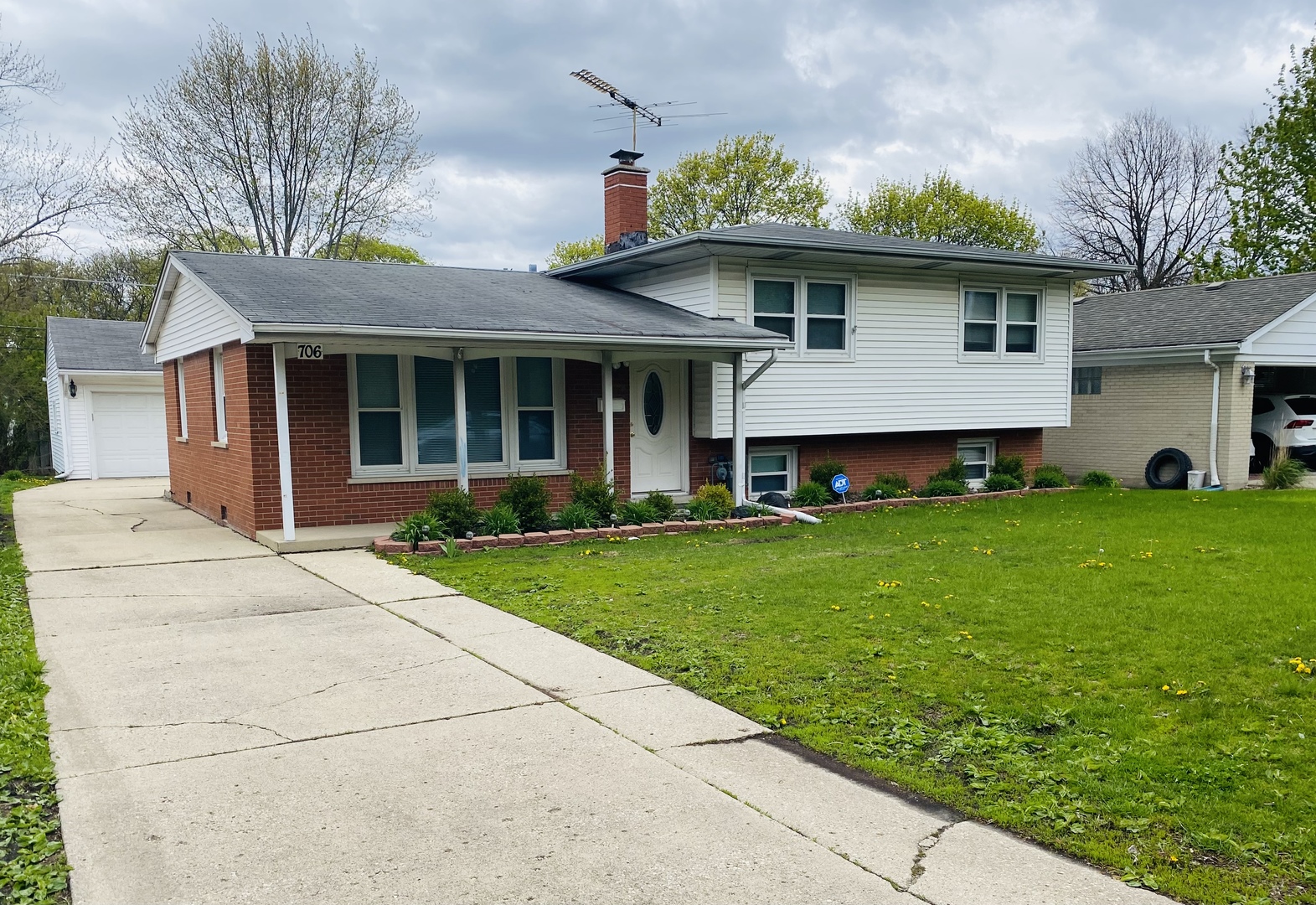 706 South Arlington Heights Road Arlington Heights, IL 60005 - Photo 1 of 3 a front view of a house with garden