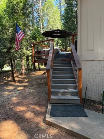 a living room with furniture a rug and a window
