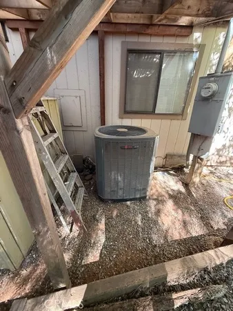 a kitchen with sink a window and cabinets