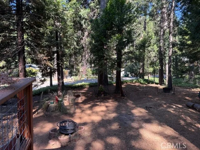 a kitchen with stainless steel appliances granite countertop a refrigerator a sink a stove and white cabinets