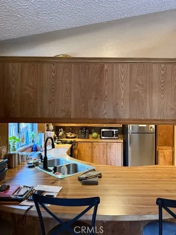 a living room with furniture a window and a fireplace