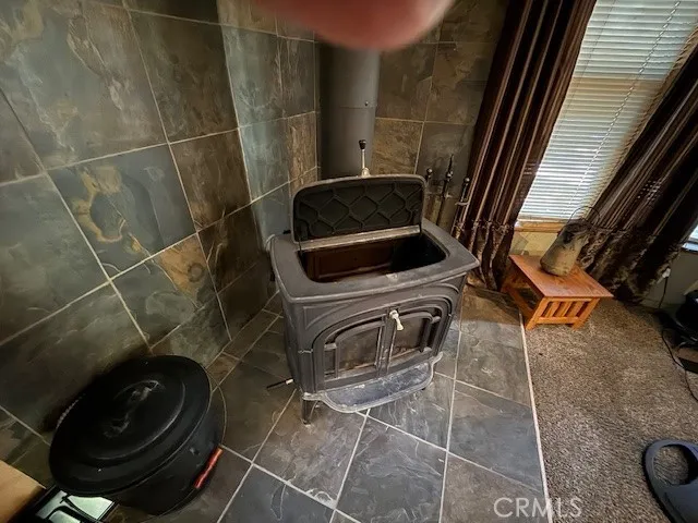 a room with furniture a rug and a wall painting