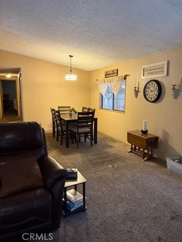 a bathroom with a sink a toilet a mirror and a shower