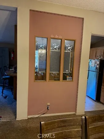 a bedroom with a bed and dresser