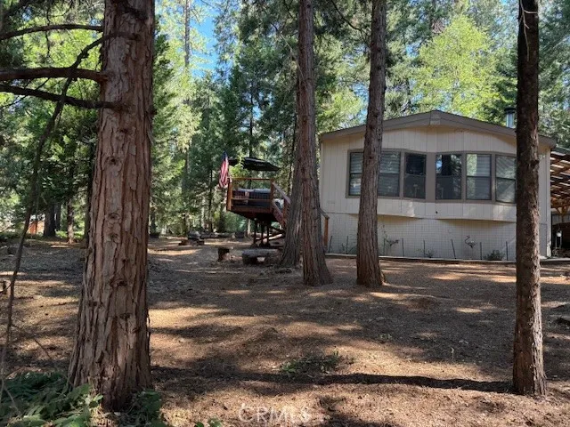 a backyard of a house with lots of green space