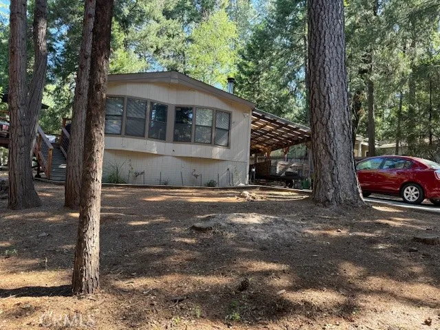 a view of a backyard with sitting area
