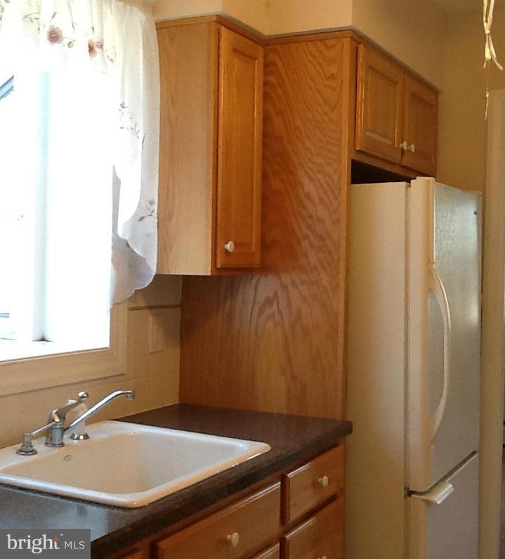 3312 Croydon Road Baltimore, MD 21207 - Photo 12 of 22 a bathroom with a sink and a mirror