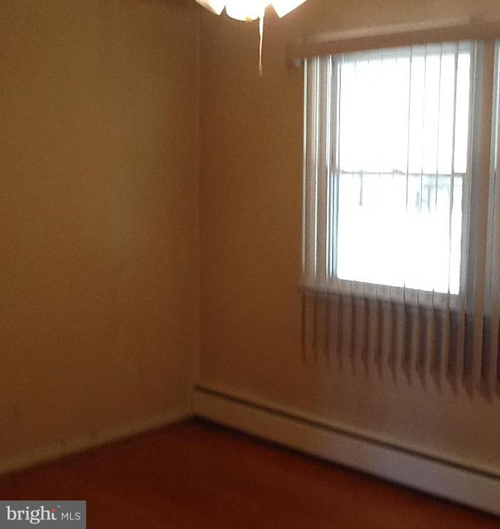 3312 Croydon Road Baltimore, MD 21207 - Photo 15 of 22 an empty room with a window