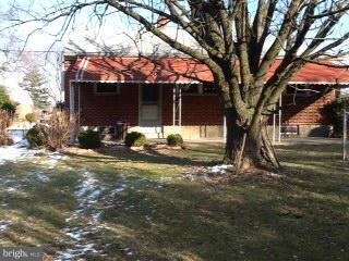 3312 Croydon Road Baltimore, MD 21207 - Photo 6 of 22 a house with trees in front of it