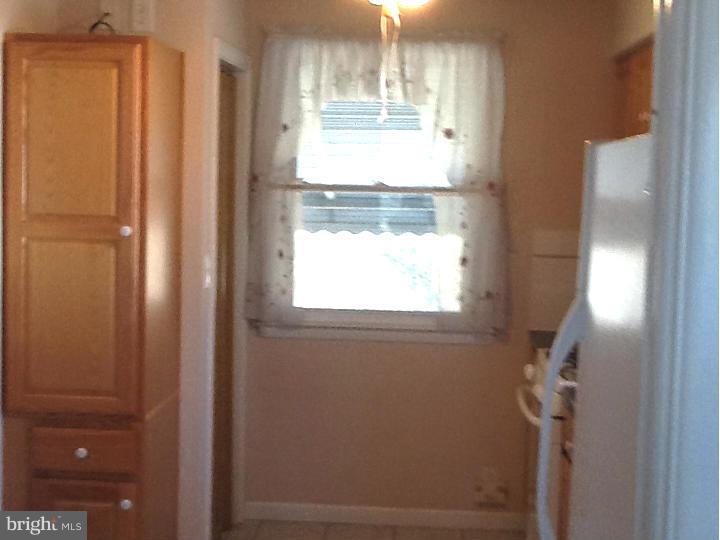 3312 Croydon Road Baltimore, MD 21207 - Photo 10 of 22 a bathroom with a window and a shower
