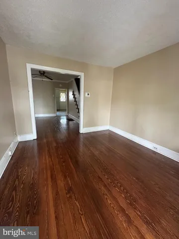 wooden floor in a hall with a window