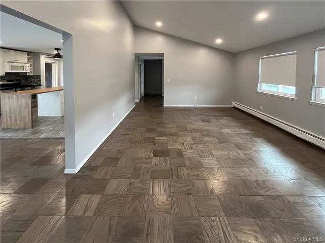 a view of a kitchen with a sink and a window