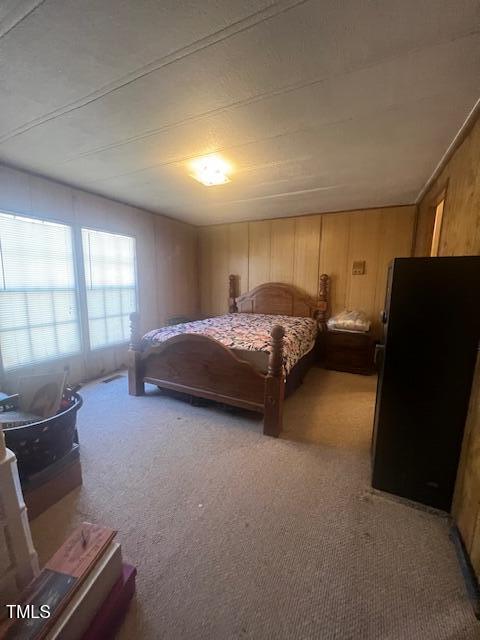 887 Bish Road Staley, NC 27355 - Photo 11 of 17 a bedroom with a bed and window