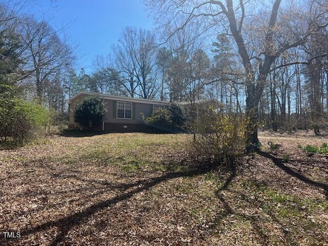 887 Bish Road Staley, NC 27355 - Photo 4 of 17 a view of a yard