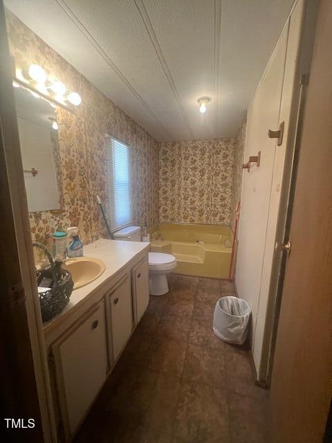 887 Bish Road Staley, NC 27355 - Photo 10 of 17 a bathroom with a granite countertop sink a toilet a mirror a bathtub and shower