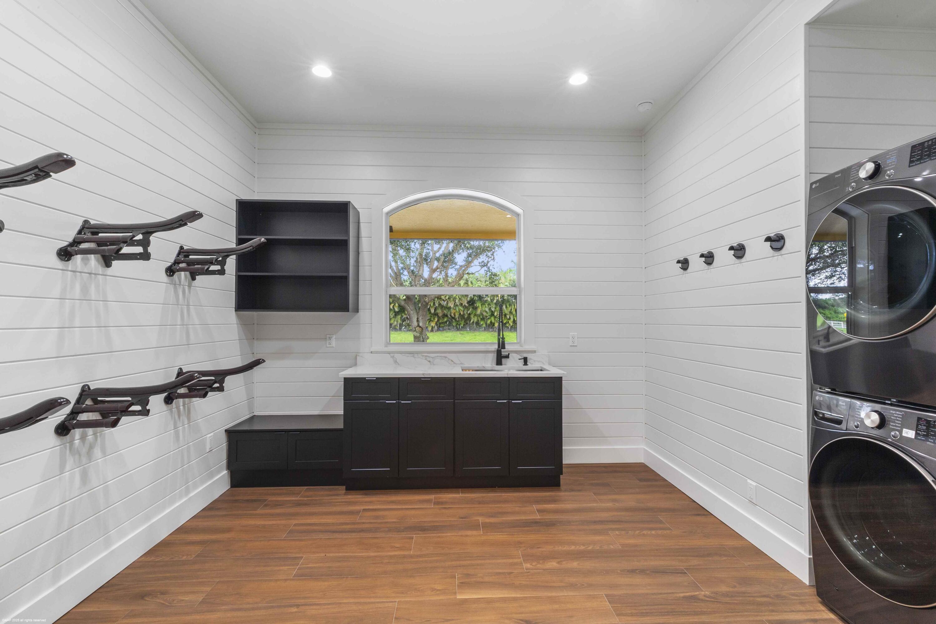 4985 Stables Way Wellington, FL 33414 - Photo 13 of 79 a view of kitchen and sink with wooden floor