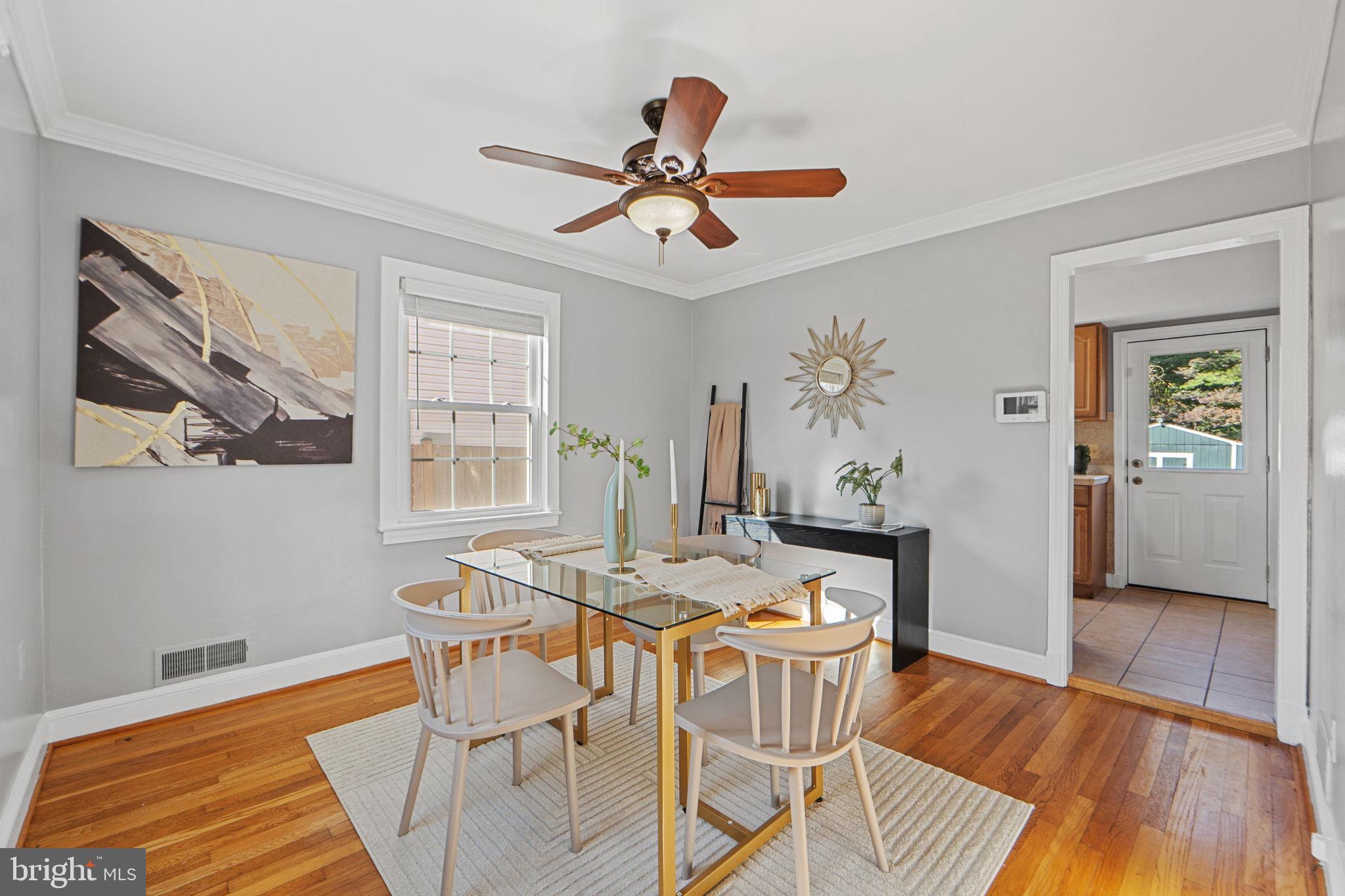 2405 Homestead Drive Silver Spring, MD 20902 - Photo 12 of 43 a view of a dining room with furniture window and wooden floor