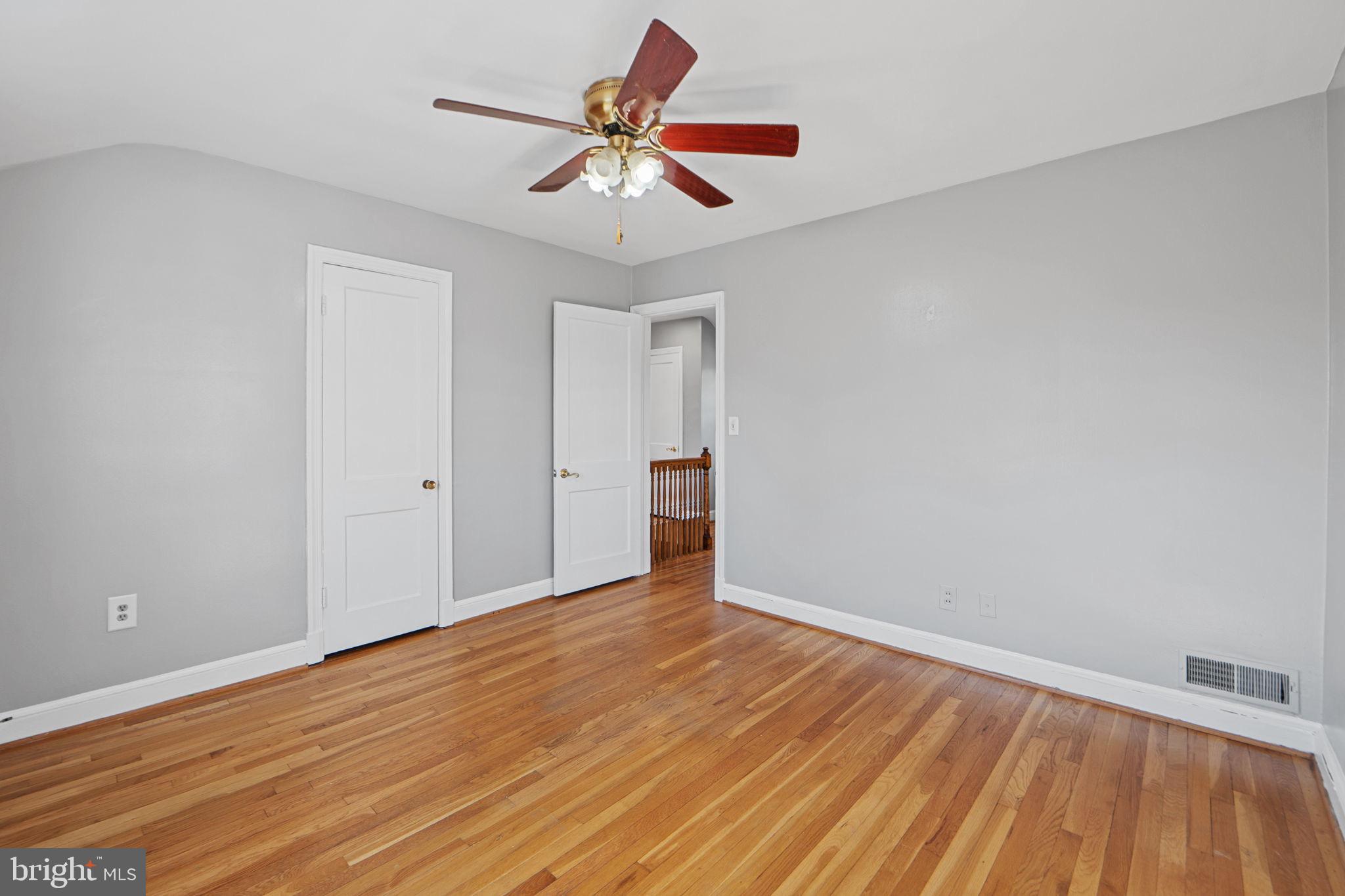 2405 Homestead Drive Silver Spring, MD 20902 - Photo 18 of 43 a view of room with wooden floor and ceiling fan