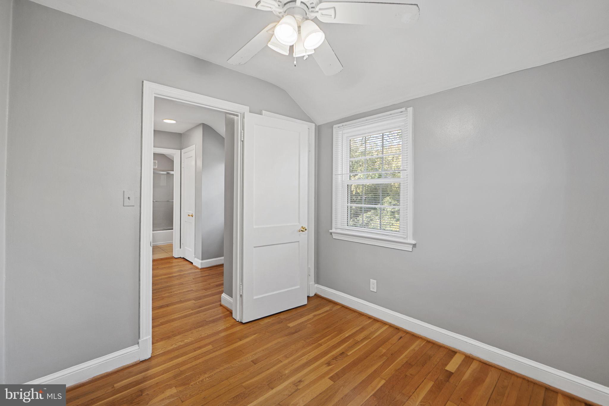 2405 Homestead Drive Silver Spring, MD 20902 - Photo 20 of 43 wooden floor in an empty room with a window
