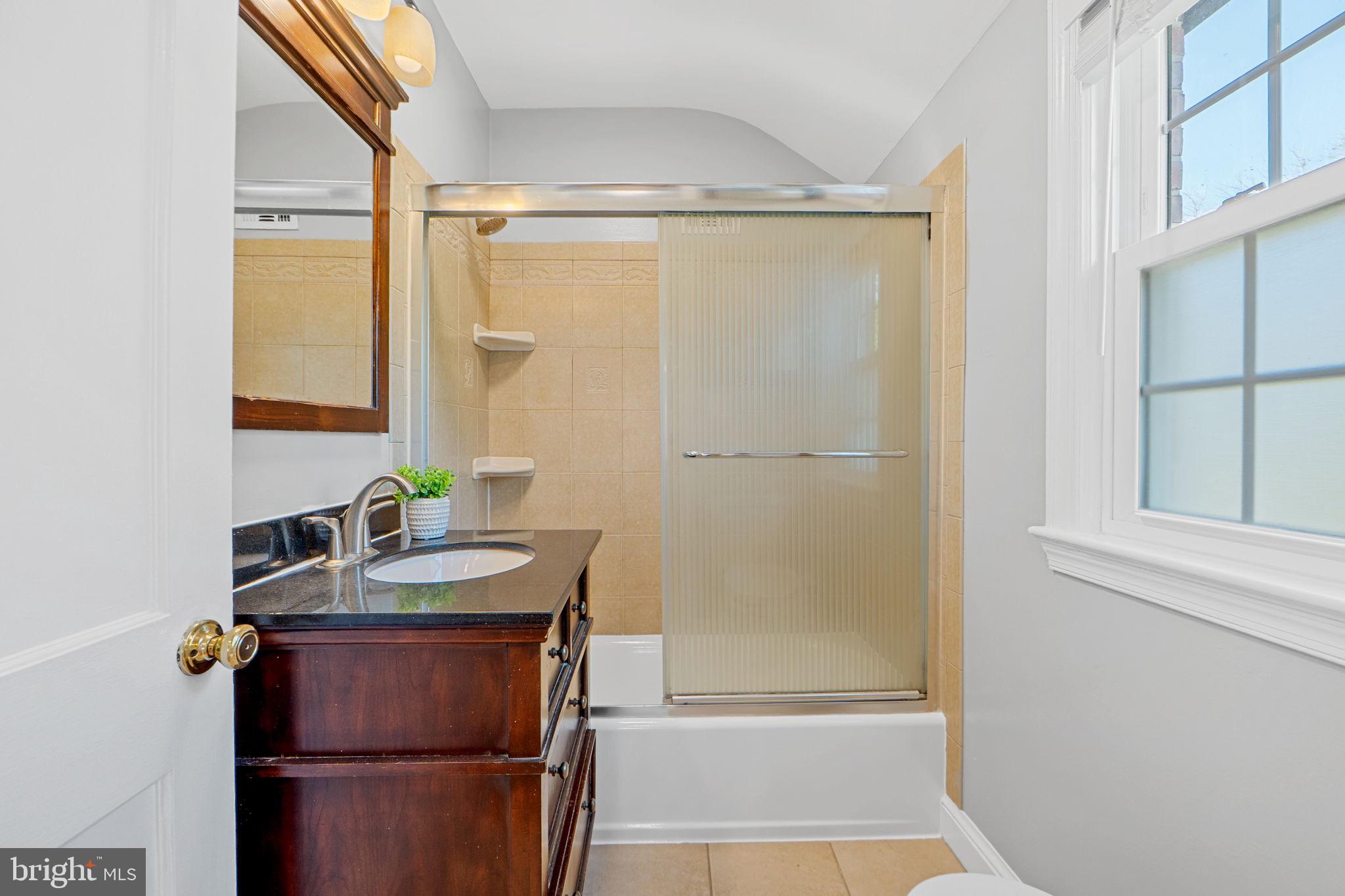 2405 Homestead Drive Silver Spring, MD 20902 - Photo 21 of 43 a bathroom with a sink and a mirror