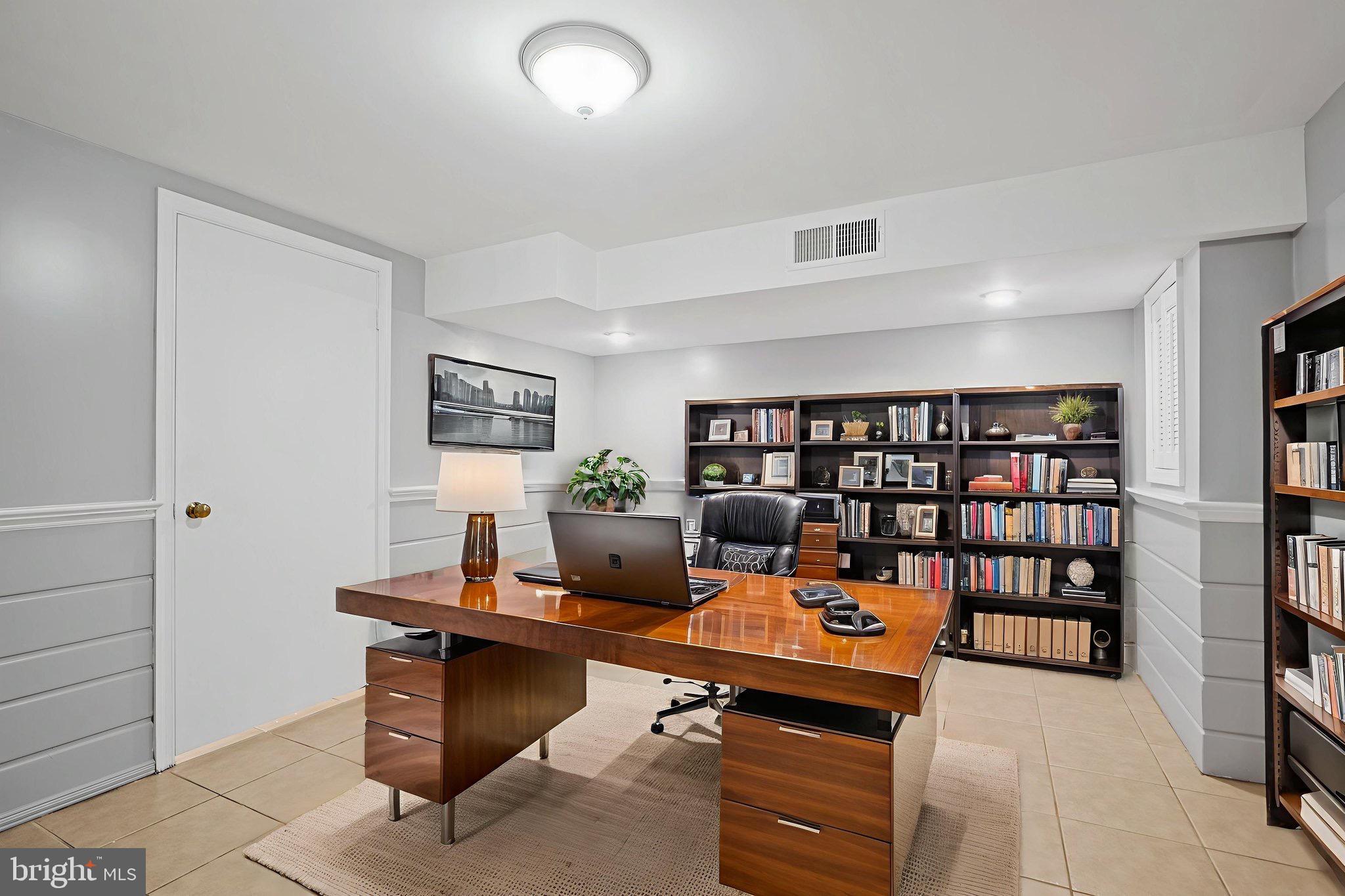 2405 Homestead Drive Silver Spring, MD 20902 - Photo 27 of 43 a reading room with furniture and book shelf