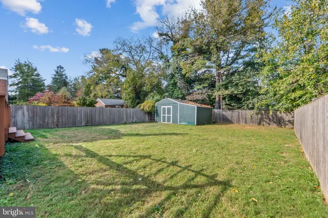 a house with trees in the background