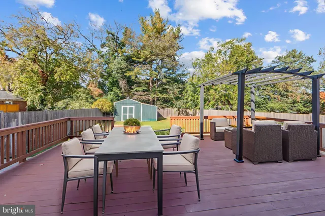 a view of a deck with wooden floor and fence