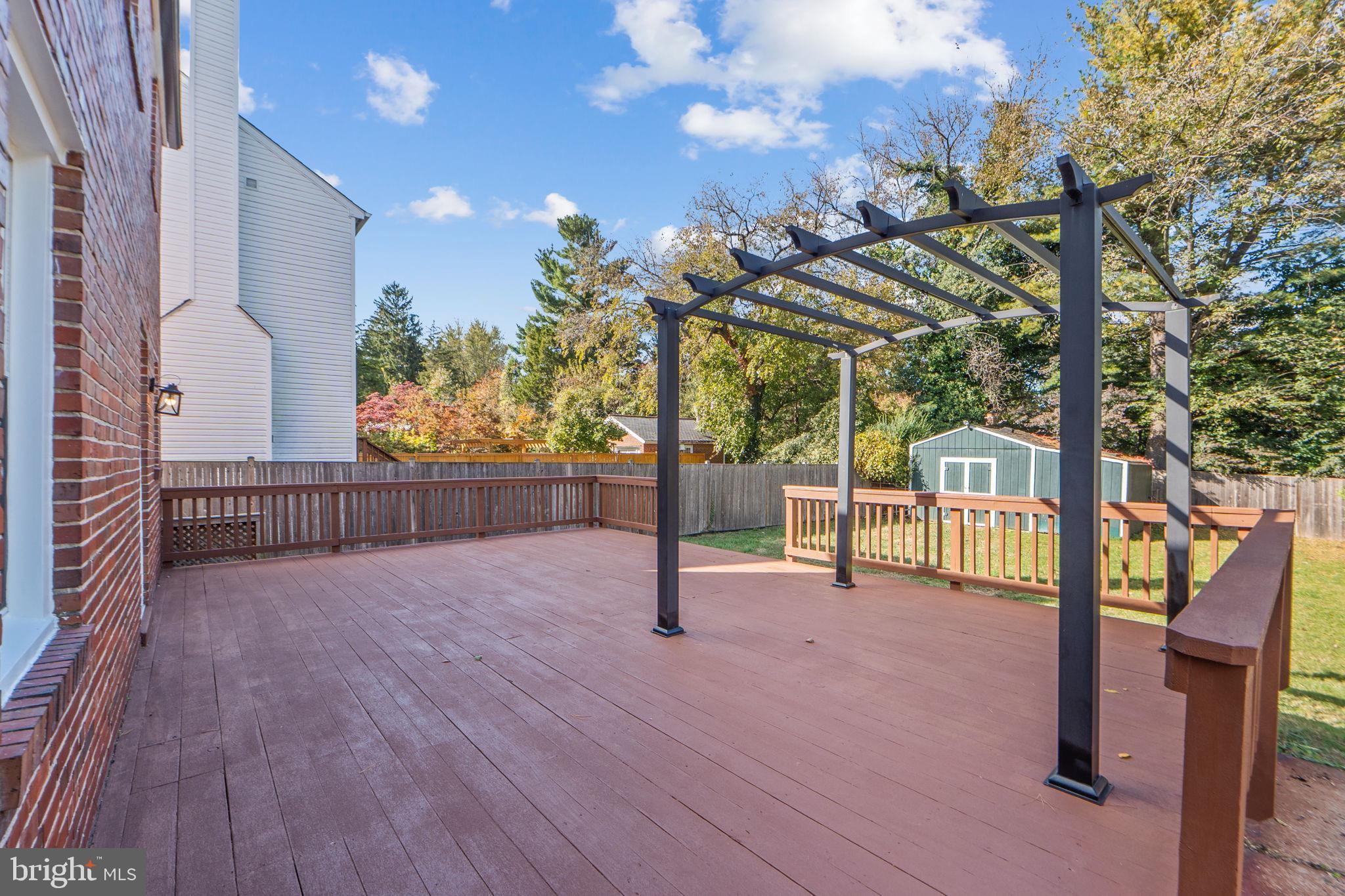 2405 Homestead Drive Silver Spring, MD 20902 - Photo 41 of 43 a view of a deck with wooden floor and fence