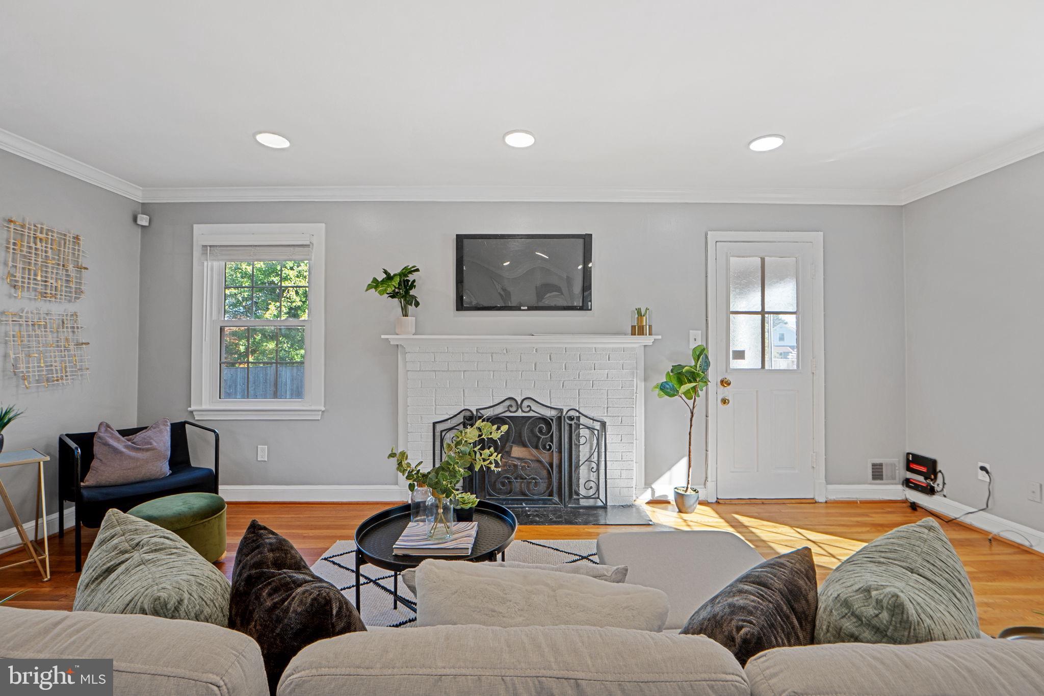 2405 Homestead Drive Silver Spring, MD 20902 - Photo 6 of 43 a living room with furniture and a fireplace