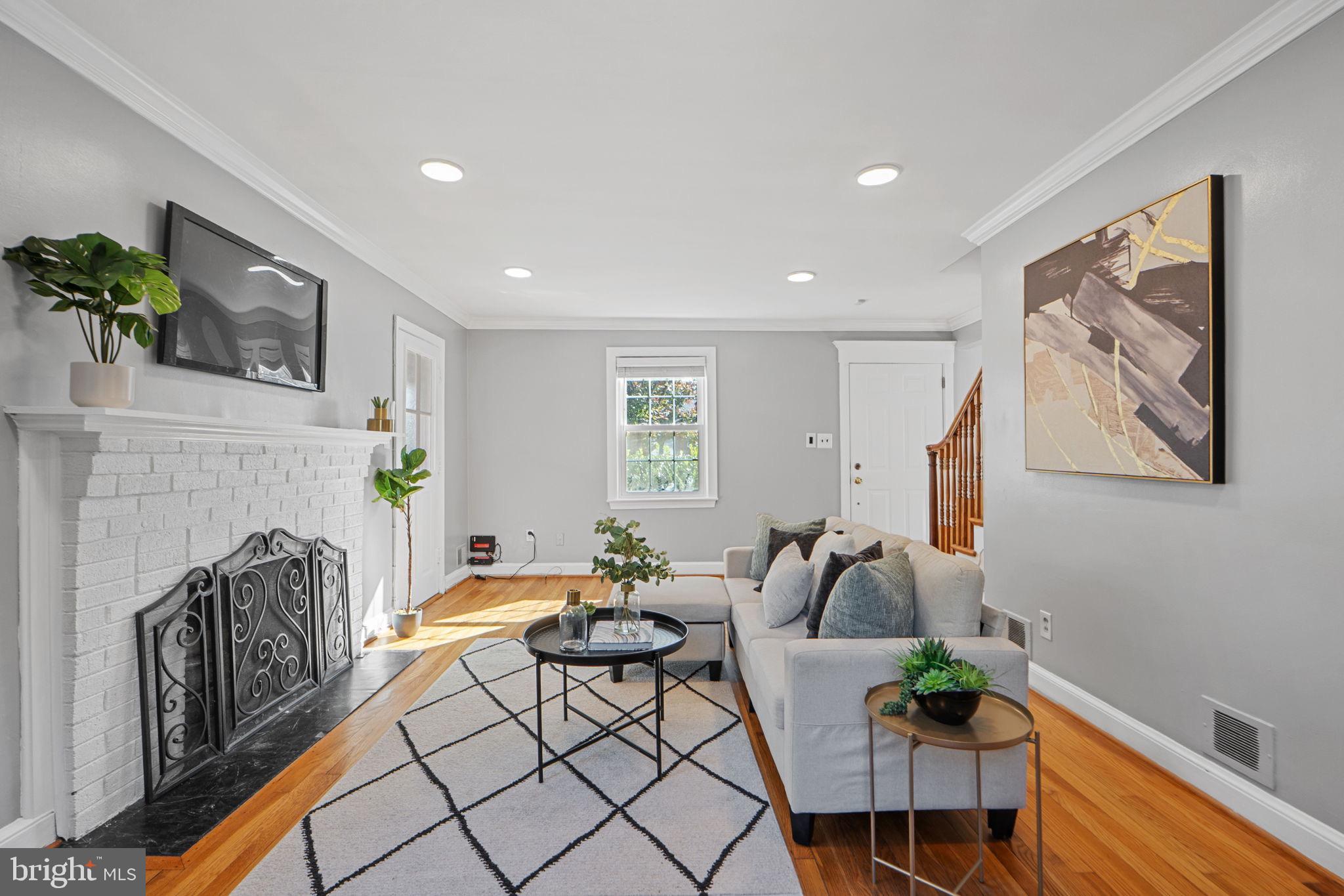 2405 Homestead Drive Silver Spring, MD 20902 - Photo 7 of 43 a living room with furniture and a fireplace