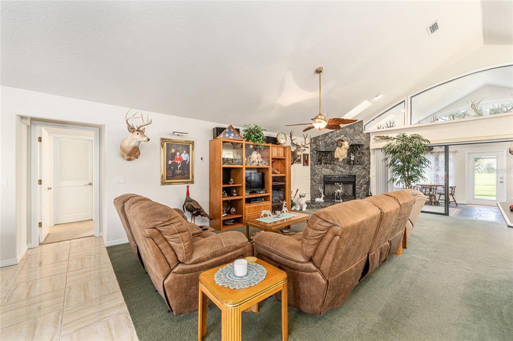 255 Southwest 96th Lane Ocala, FL 34476 - Photo 30 of 92 a living room with furniture a dining table and chairs