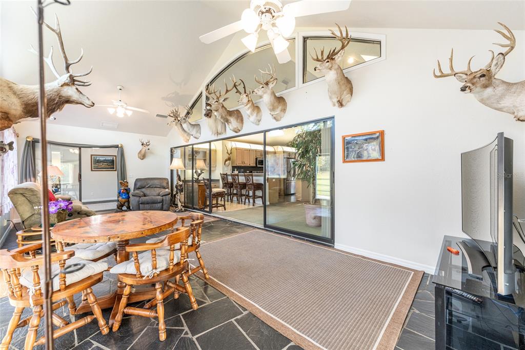 255 Southwest 96th Lane Ocala, FL 34476 - Photo 35 of 92 a view of a dining room with furniture and wooden floor
