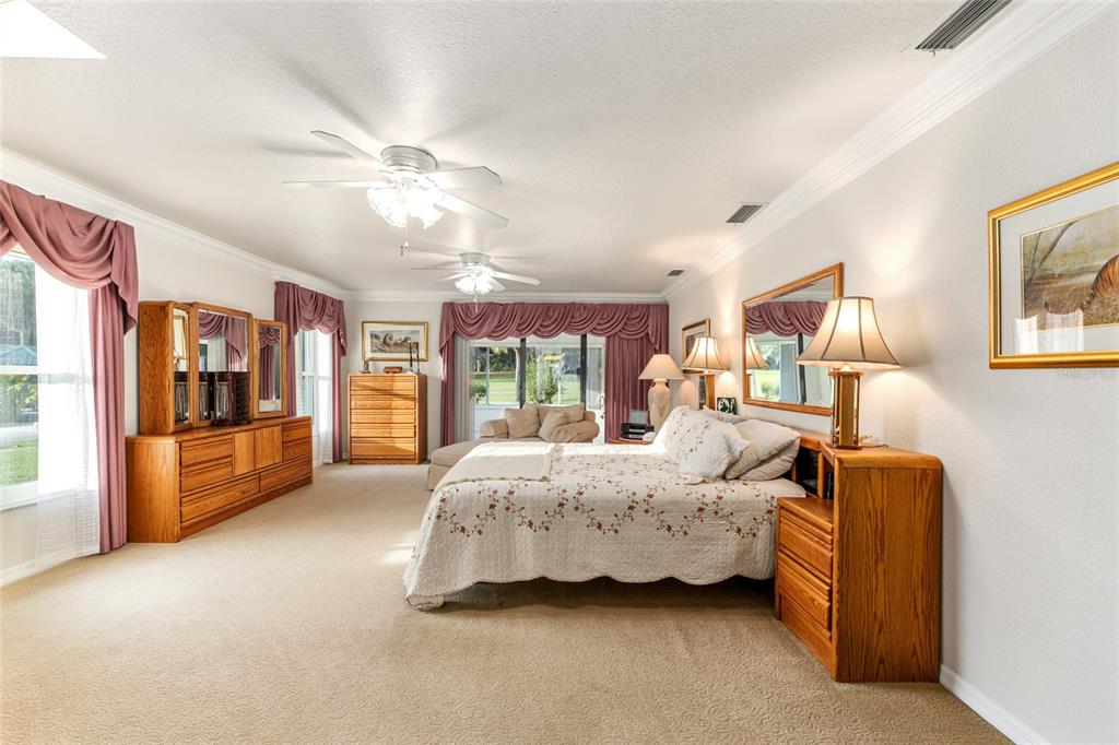 255 Southwest 96th Lane Ocala, FL 34476 - Photo 37 of 92 a bed room with a bed and a large window