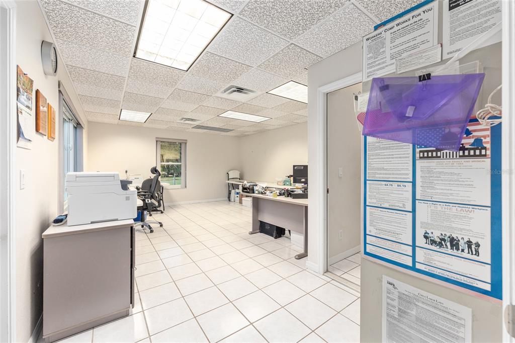 255 Southwest 96th Lane Ocala, FL 34476 - Photo 50 of 92 a kitchen with stainless steel appliances kitchen island granite countertop a sink and cabinets