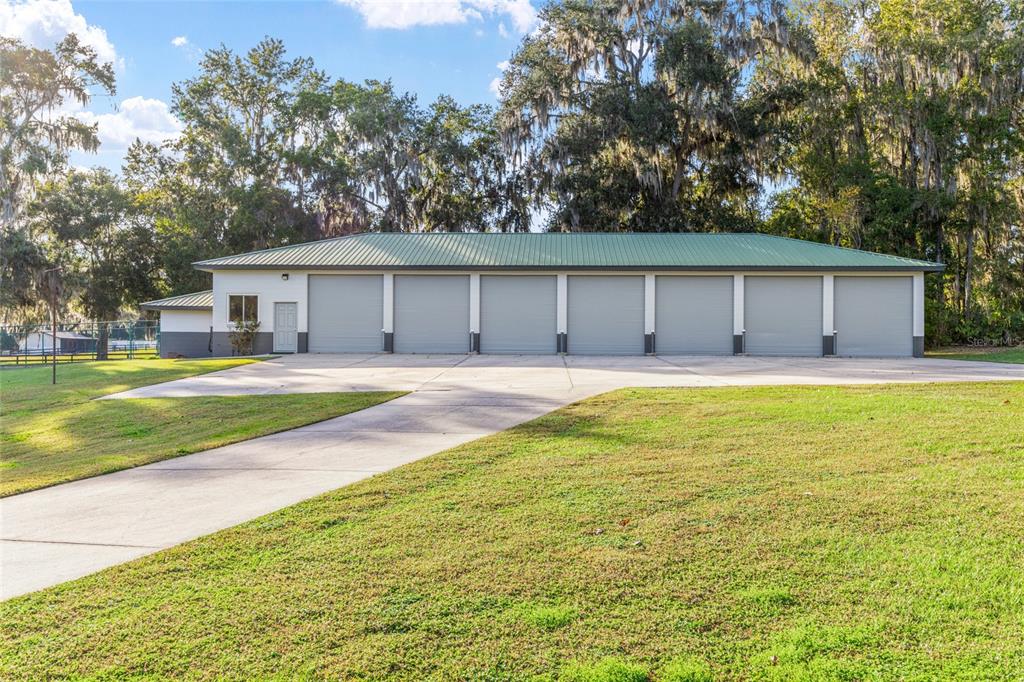 255 Southwest 96th Lane Ocala, FL 34476 - Photo 54 of 87 a swimming pool with trees in the background