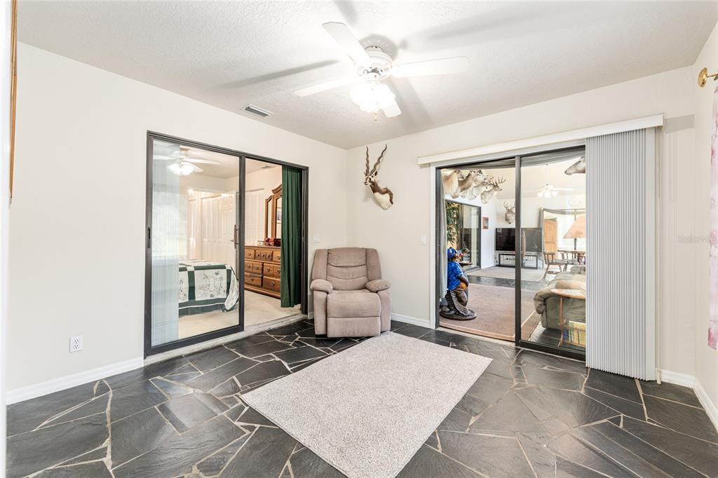 255 Southwest 96th Lane Ocala, FL 34476 - Photo 56 of 92 a living room with furniture and a large window
