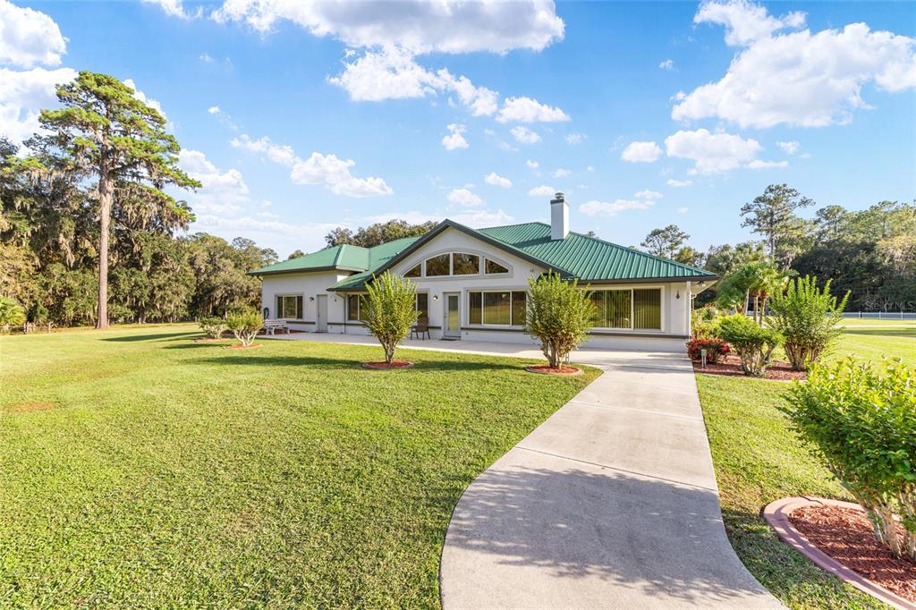 255 Southwest 96th Lane Ocala, FL 34476 - Photo 60 of 87 a front view of a house with a yard