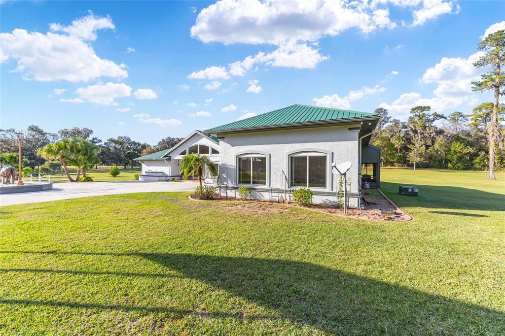 255 Southwest 96th Lane Ocala, FL 34476 - Photo 76 of 92 a view of an house with swimming pool and porch with furniture