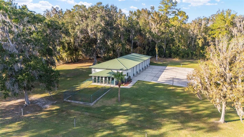255 Southwest 96th Lane Ocala, FL 34476 - Photo 89 of 92 a view of a swimming pool with a yard