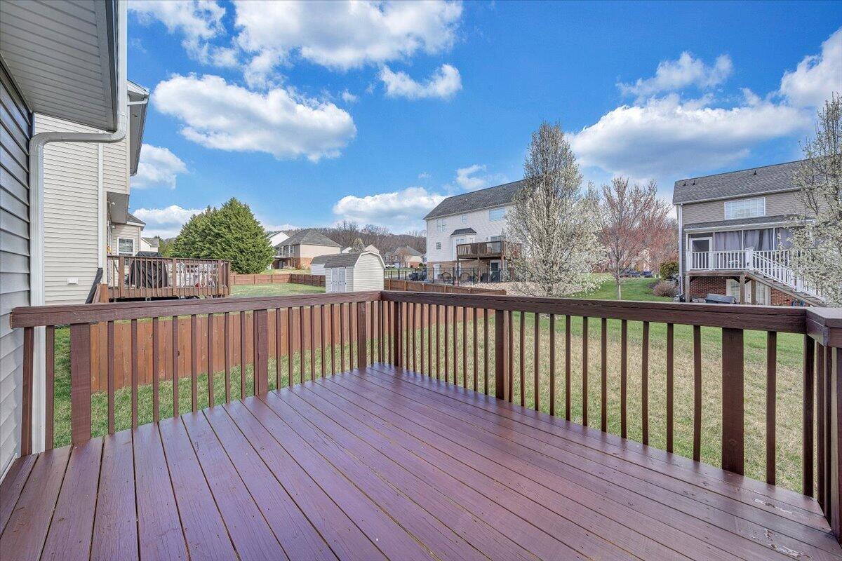 427 Cambridge Ct Road Vinton, VA 24179 - Photo 35 of 46 a balcony with wooden floor and city view