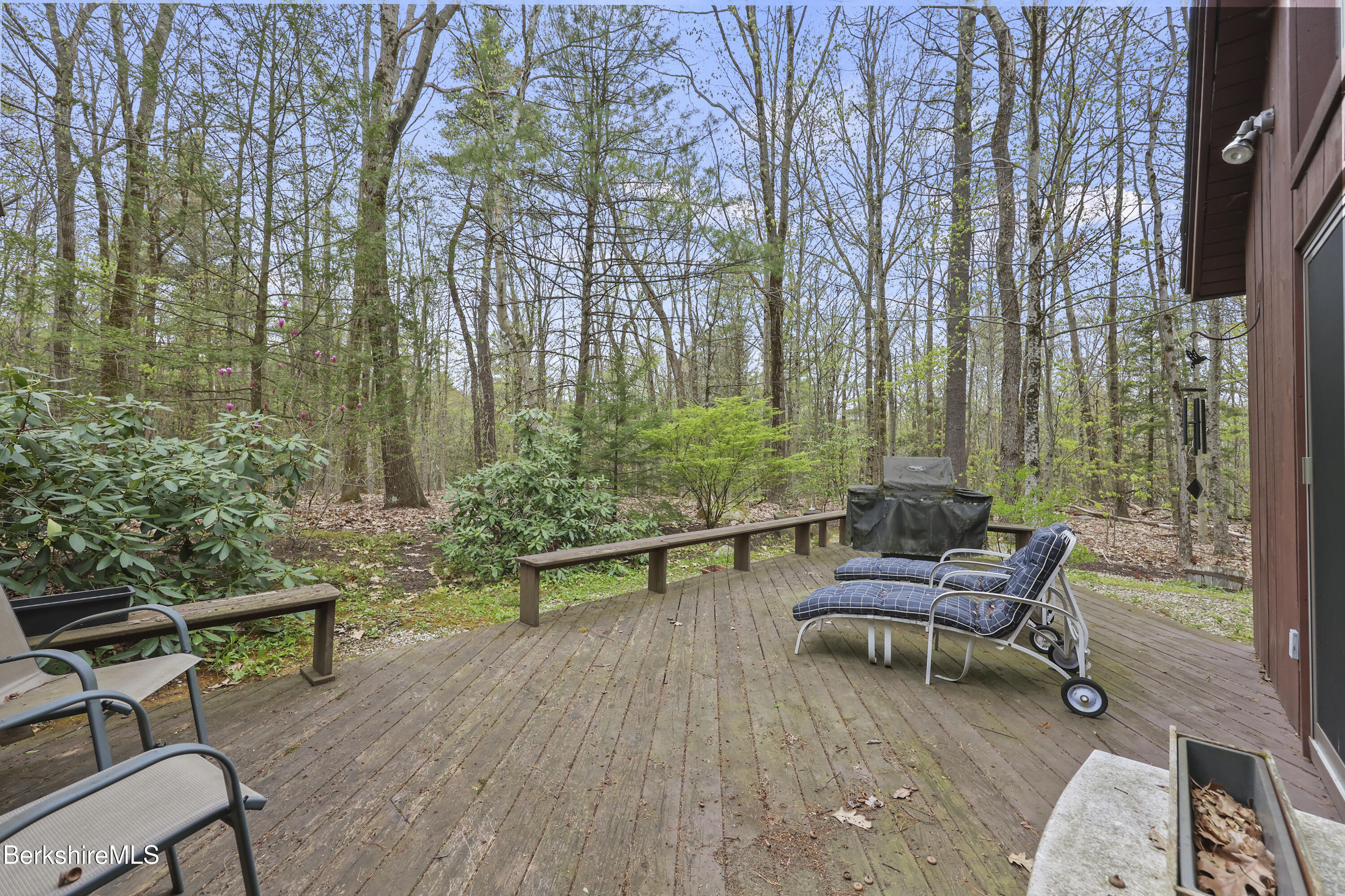422 Bonny Rigg Hill Road Becket, MA 01223 - Photo 45 of 60 a swimming pool with outdoor seating and trees