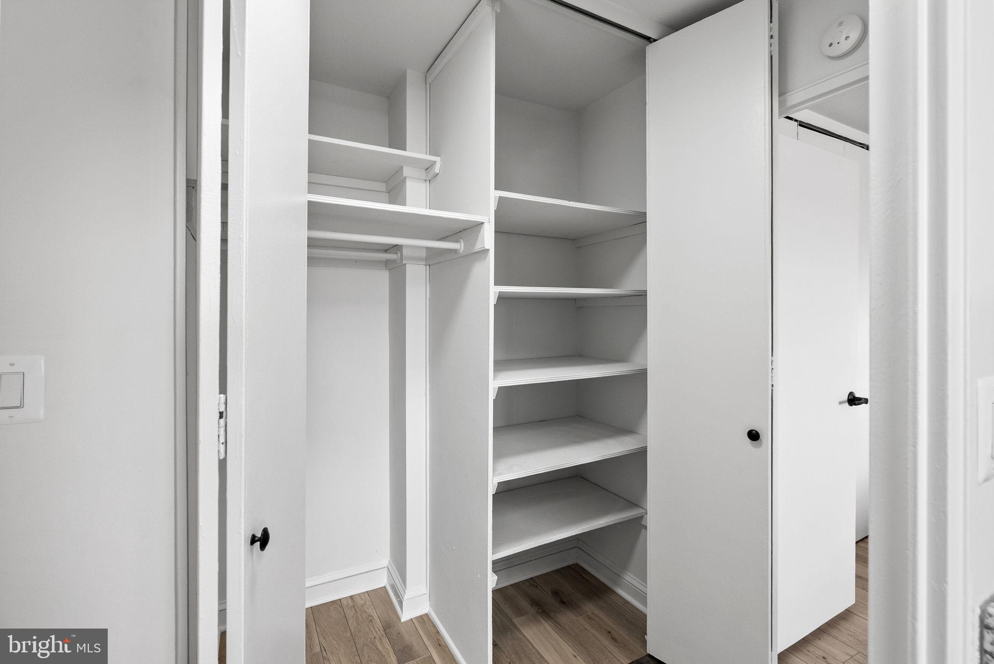 1600 Hagys Ford Road, Unit 8U Penn Valley, PA 19072 - Photo 20 of 44 a view of a walk in closet with empty racks