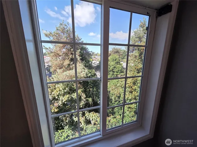 a view of an entryway with wooden floor